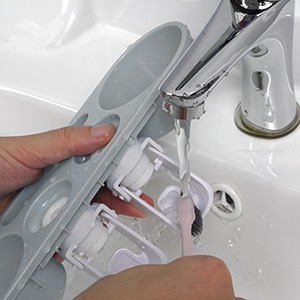 toothpaste dispenser and toothbrush holder